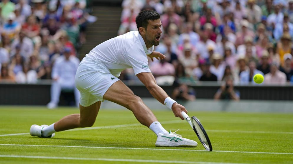 Serbia's Novak Djokovic returns to Italy's Jannik Sinner in a men's singles quarterfinal match on day nine of the Wimbledon tennis championships in London, Tuesday, July 5, 2022. (AP Photo/Alastair Grant)