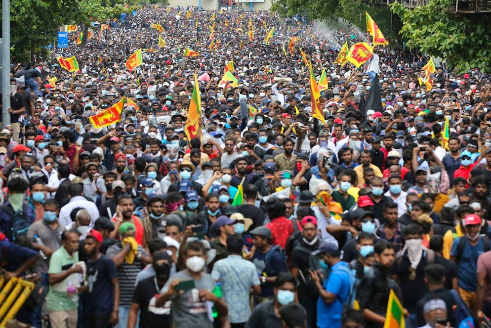 epa10061012 People attend an anti government protest rally, calling for the resignation of the president over the alleged failure to address the economic crisis, near the President's house in Colombo, Sri Lanka, 09 July 2022. Protests have been rocking the country for over three months, calling for the resignation of the president and prime minister over the alleged failure to address the economic crisis. Sri Lanka faces its worst-ever economic crisis in decades due to the lack of foreign reserves, resulting in severe shortages in food, fuel, medicine, and imported goods. EPA/CHAMILA KARUNARATHNE