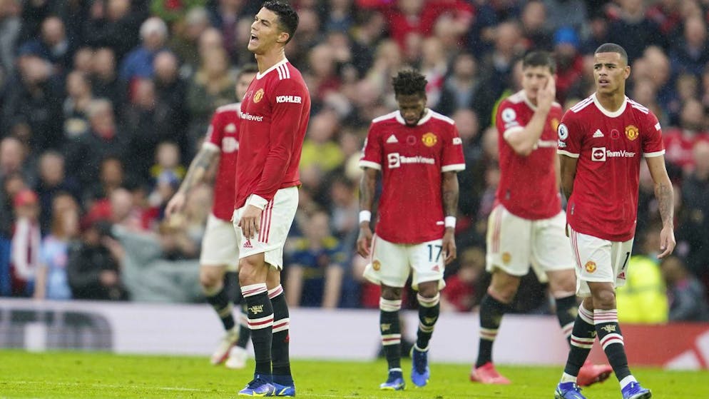 Manchester United's Cristiano Ronaldo, left, reacts with his teammates after Manchester City's Bernardo Silva scored his side's second goal during the English Premier League soccer match between Manchester United and Manchester City at Old Trafford stadium in Manchester, England, Saturday, Nov. 6, 2021. (AP Photo/Jon Super)