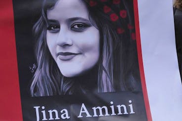 Iranian nationals living in Ecuador protest against the death of Mahsa Amini, a 22-year-old who died in Iran while in police custody, in front of the Foreign Ministry building in Quito, Ecuador, Wednesday, Oct. 5, 2022. Amini was arrested by Iran's morality police for allegedly violating its strictly-enforced dress code. (AP Photo/Dolores Ochoa)
