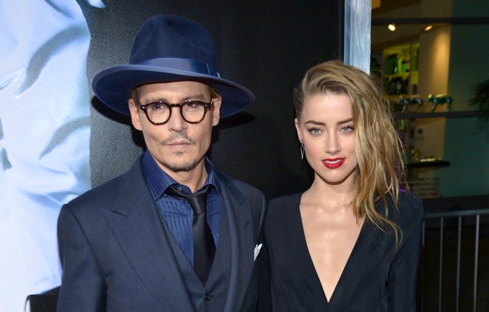 Johnny Depp, left, and Amber Heard arrive at the US premiere of 