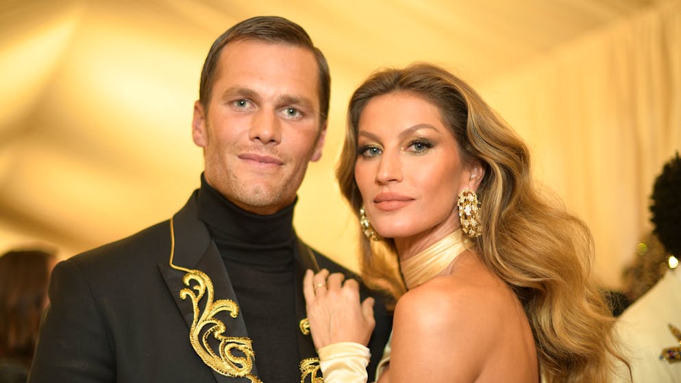 Tom Brady and Gisele Bundchen.  Tom Brady and Gisele Bundchen are ex-husbands.  Their villas now stand next to each other - probably because of the children.