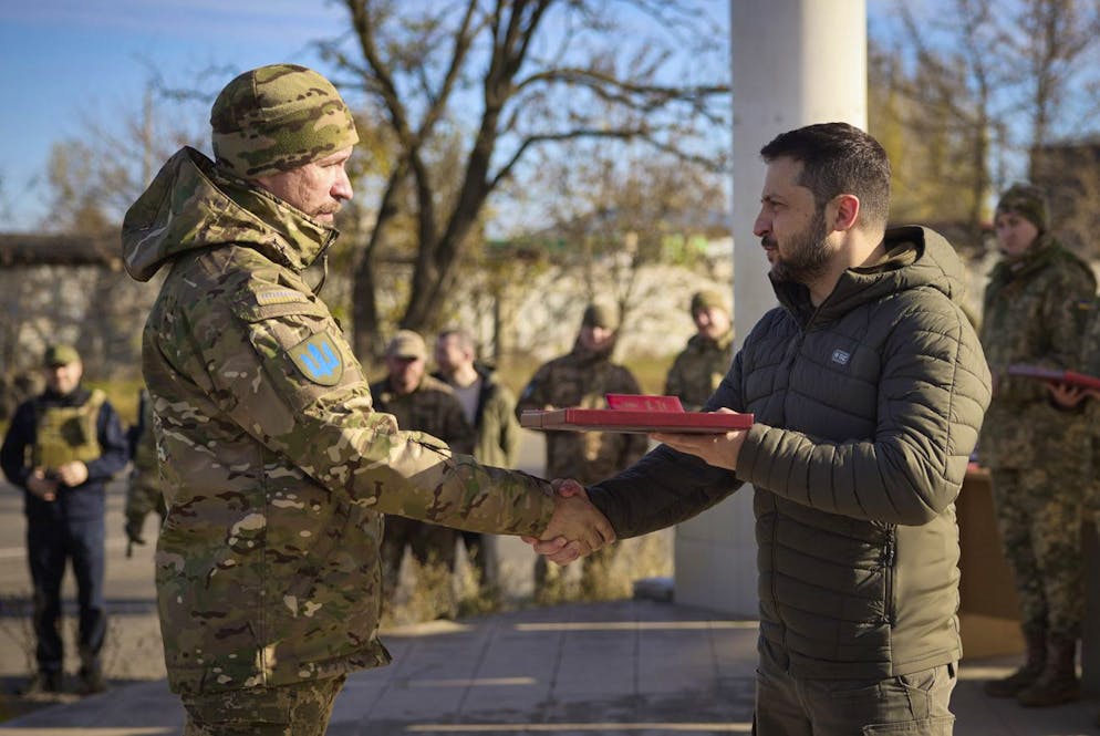 In this photo provided by the Ukrainian Presidential Press Office and posted on Facebook, Ukrainian President Volodymyr Zelenskyy, right, awards a serviceman during his visit to Kherson, Ukraine, Monday, Nov. 14, 2022. Ukraine's retaking of Kherson was a significant setback for the Kremlin and it came some six weeks after Russian President Vladimir Putin annexed the Kherson region and three other provinces in southern and eastern Ukraine âÄ” in breach of international law âÄ” and declared them Russian territory. (Ukrainian Presidential Press Office via AP)
