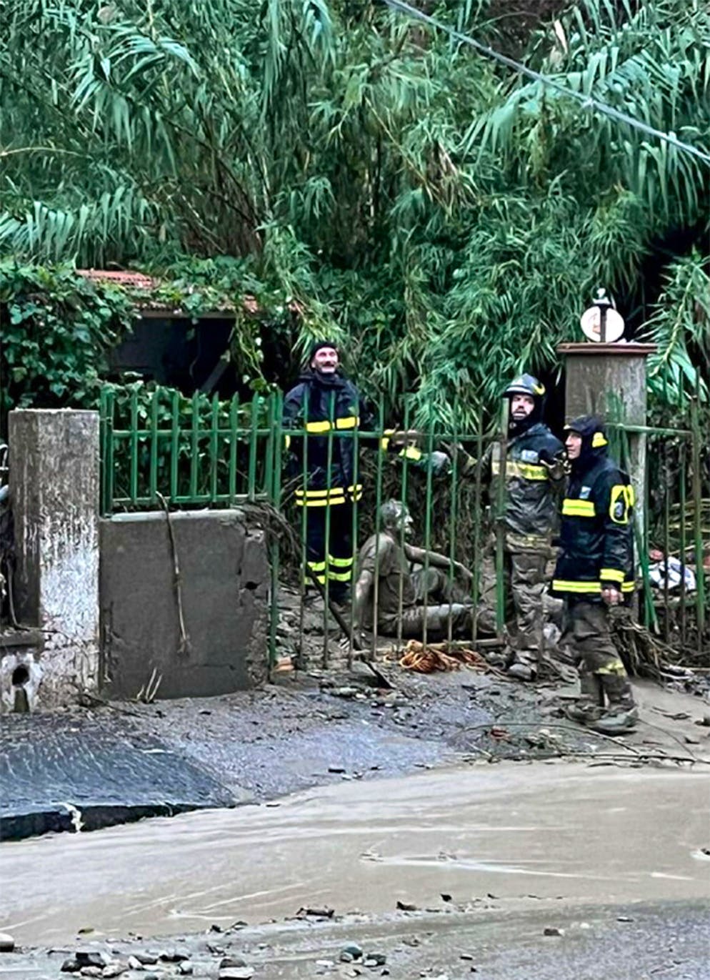 epa10329615 A man affected by the landslide is rescued by firefighters in Casamicciola, Ischia Island, Southern Italy, 26 November 2022. Thirteen people went missing on 26 November after heavy rains caused a landslide on the Italian island of Ischia.  EPA/ANSA ITALY OUT. BEST QUALITY AVAILABE.