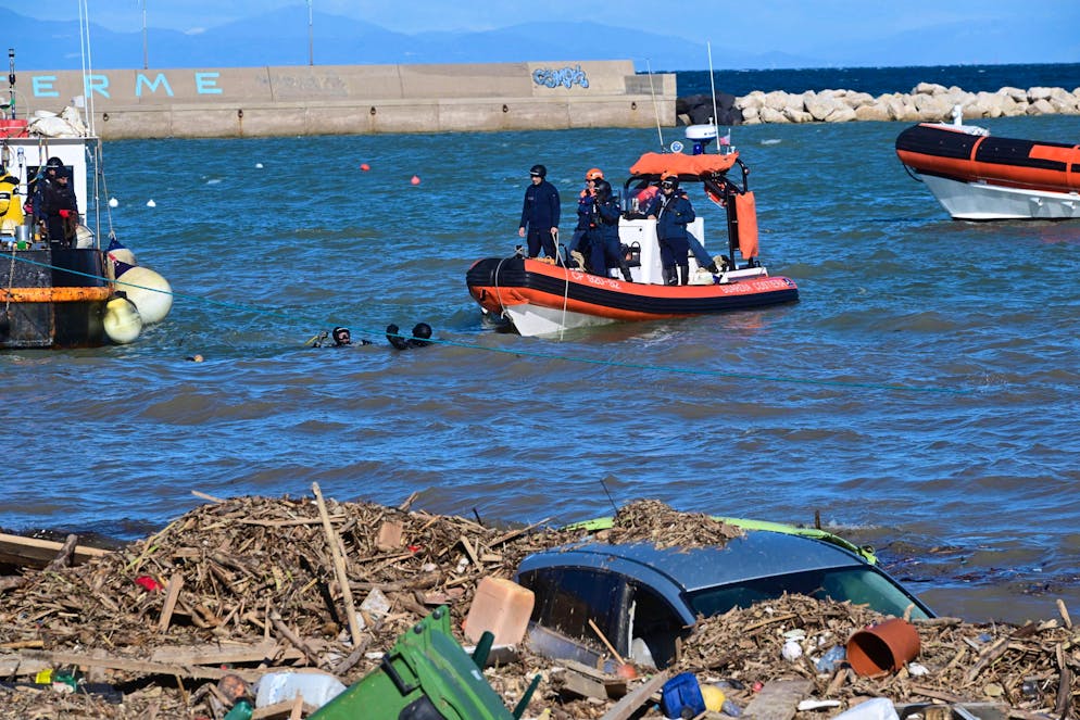 epa10332678 Debris and cars float on the shoreline in Casamicciola, Italy, 27 November 2022. Italy has declared state of emergency following the deadly landslide on Ischia Island which has left  10 people missing and at least 2 dead.  EPA/Ciro Fusco ITALY OUT
