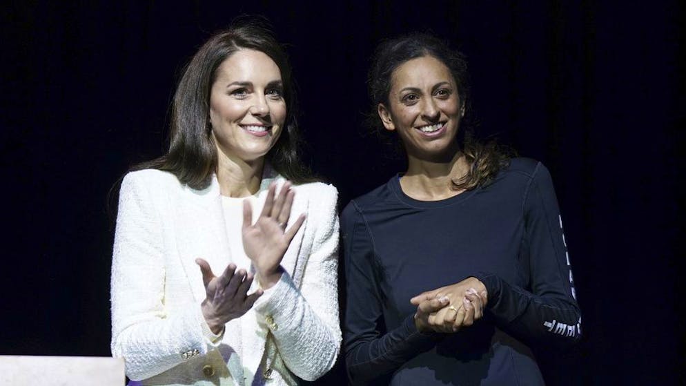 Britain's Kate, Princess of Wales, left, stands with Captain Preet Chandi, during a visit to Landau Forte College, in Derby, England, Wednesday Feb. 8, 2023, to celebrate Captain Chandi's return from her solo expedition across Antarctica. (Arthur Edwards/Pool via AP)