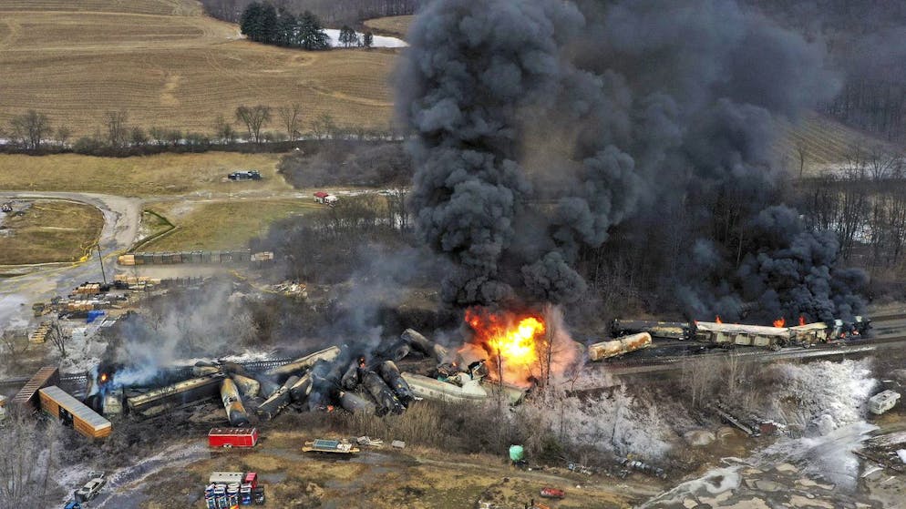 This photo taken with a drone shows portions of a Norfolk and Southern freight train that derailed Friday night in East Palestine, Ohio are still on fire at mid-day Saturday, Feb. 4, 2023. (AP Photo/Gene J. Puskar)