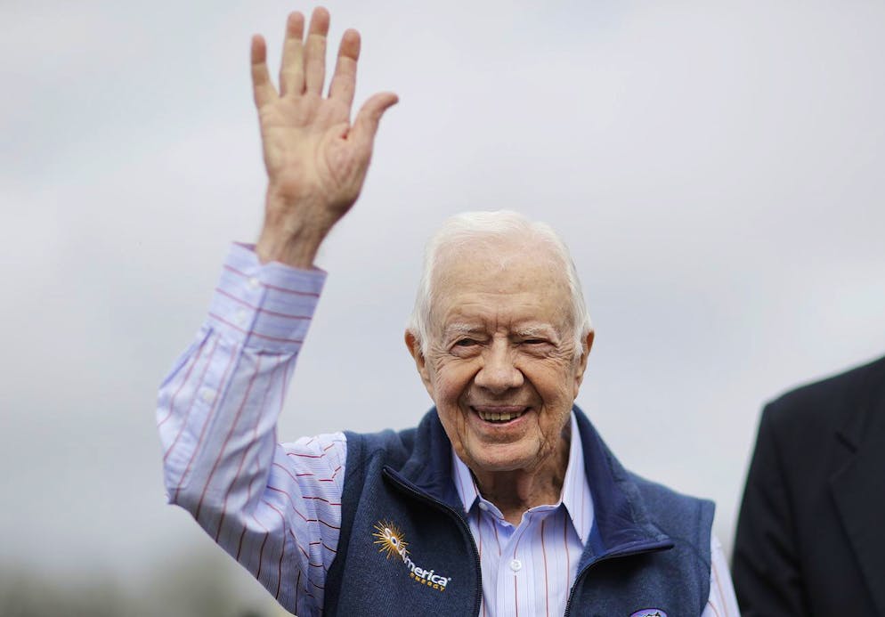 Former President Jimmy Carter waves during a ribbon cutting ceremony for a solar panel project on farmland he owns in their hometown of Plains, Ga., Wednesday, Feb. 8, 2017. Jimmy Carter, who is 92, leased the land to Atlanta-based SolAmerica Energy, which owns, operates, and sells power generated from solar cells. The company estimates the project will provide more than half of the power needed in this town of 755 people. (AP Photo/David Goldman)