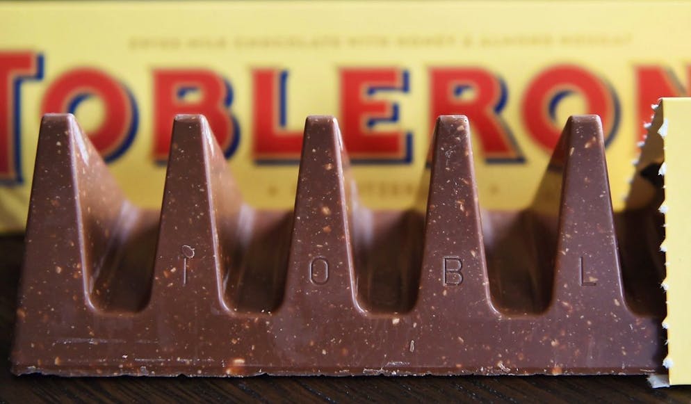 epa05622217 The new 360g Toblerone chocolate bar in London, Britain, 08 November 2016. Swiss chocolate bar brand Toblerone has reduced the size of the 400g and 170g bars of its famous triangular chocolate to reduce costs, the brand owned by US food giant Mondelez International company has announced, leading to criticism posted by consumers online. The new bars weigh 360g and 150g respectively. EPA/ANDY RAIN