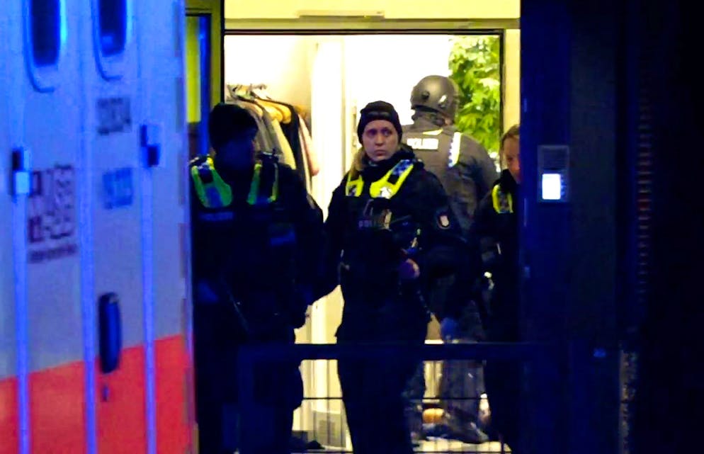 epa10512733 Armed police officers gather near the scene of a shooting in Hamburg, Germany, 09 March 2023. According to police, the shooting took place around 9 pm, killing seven people and injuring at least eight others. The gunman is believed to be among the several dead found in the building, police said.  EPA/NEWS5     BEST QUALITY AVAILABLE