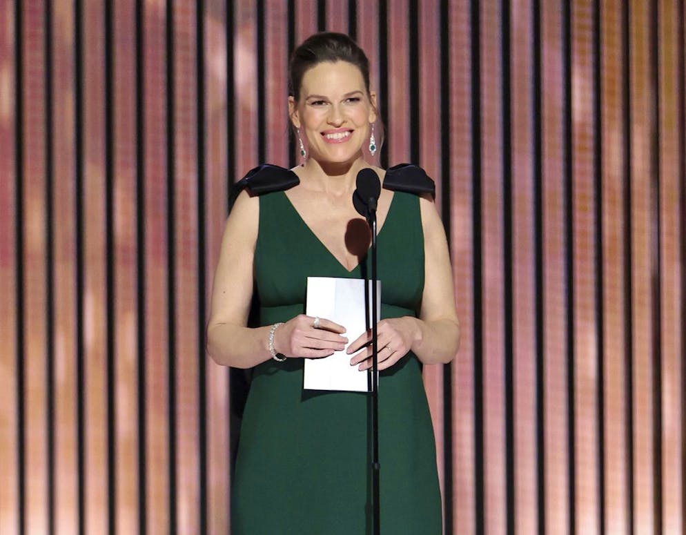 This image released by NBC shows presenter Hilary Swank during the 80th Annual Golden Globe Awards at the Beverly Hilton Hotel on Tuesday, Jan. 10, 2023, in Beverly Hills, Calif. (Rich Polk/NBC via AP)