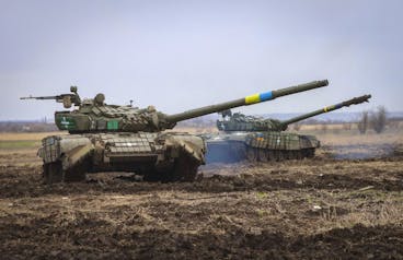 Ukrainian army tanks exercise as soldiers check the readiness of equipment for combat deployment, at a military base in Zaporizhzhia region, Ukraine, Wednesday, Apr. 5, 2023. (AP Photo/Kateryna Klochko)