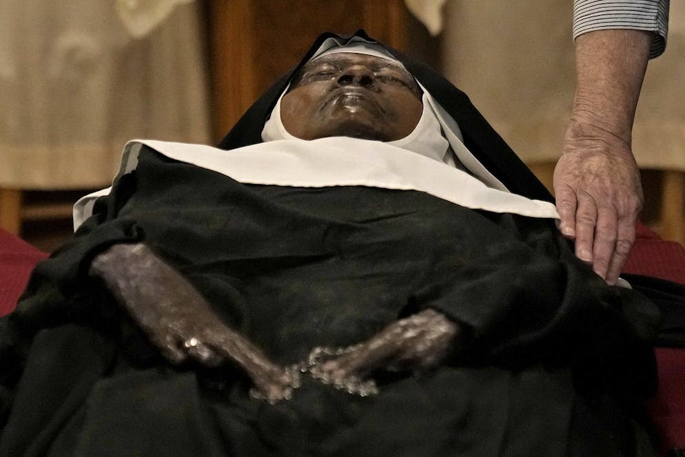 Sister Wilhelmina.  People pray over the body of Sister Wilhelmina Lancaster at the Benedictine Abbey of Mary, Queen of Apostles, Sunday, May 28, 2023, near Gower, Missouri.  Hundreds of people visited the small Missouri town this week to view the nun's body which has barely decomposed since 2019.