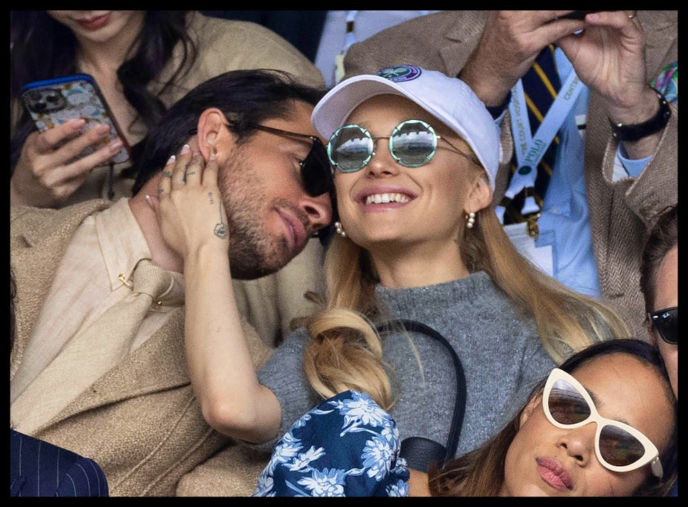 Ariana Grande and actor Jonathan Bailey at Wimbledon.  The singer is not wearing a wedding ring.