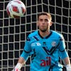 From left St.Gallens player Patrick Sutter and Luganos goalkeeper Amir Saipi, during the Super League soccer match FC Lugano against FC St. Gallen, at the Cornaredo Stadium in Lugano, Saturday, July 29, 2023. (KEYSTONE/Ti-Press/Samuel Golay)