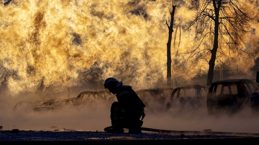 A firefighter tries to extinguish a burning gas pipeline that was ignited by a Russian missile on January 2, 2024. 