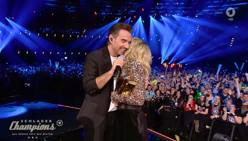 Florian Silbersen hugs his ex-girlfriend Helene Fischer as a tribute to her on the ARD programme 