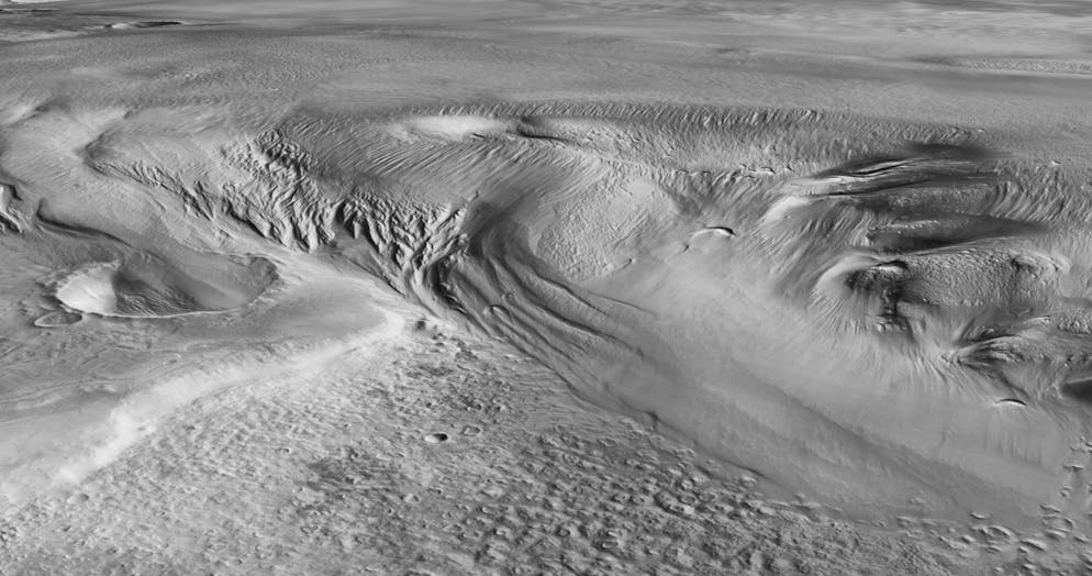 Das Bild zeigt die Region Eumenides Dorsum in der Formation Medusae Fossae, wo vermutlich die dickste eishaltige Ablagerung zu finden ist.
