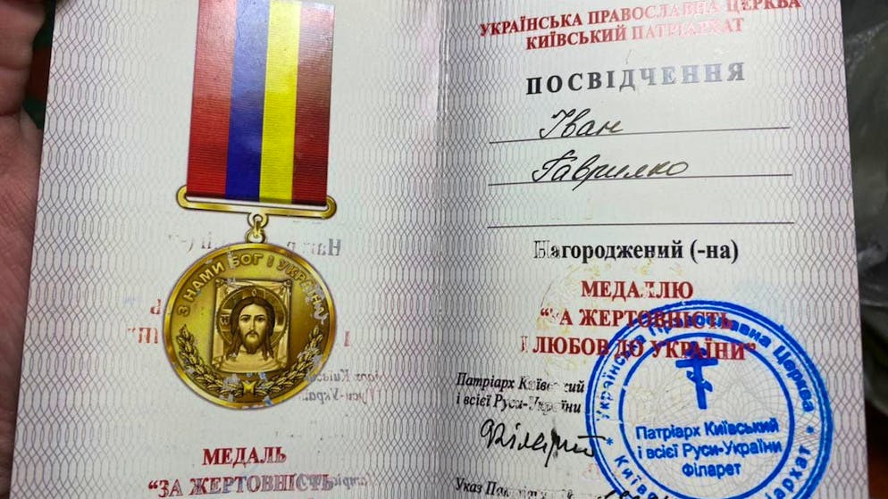 The Orthodox Church of Ukraine issued this certificate to the veterans.  Many now send them back with a matching medal.