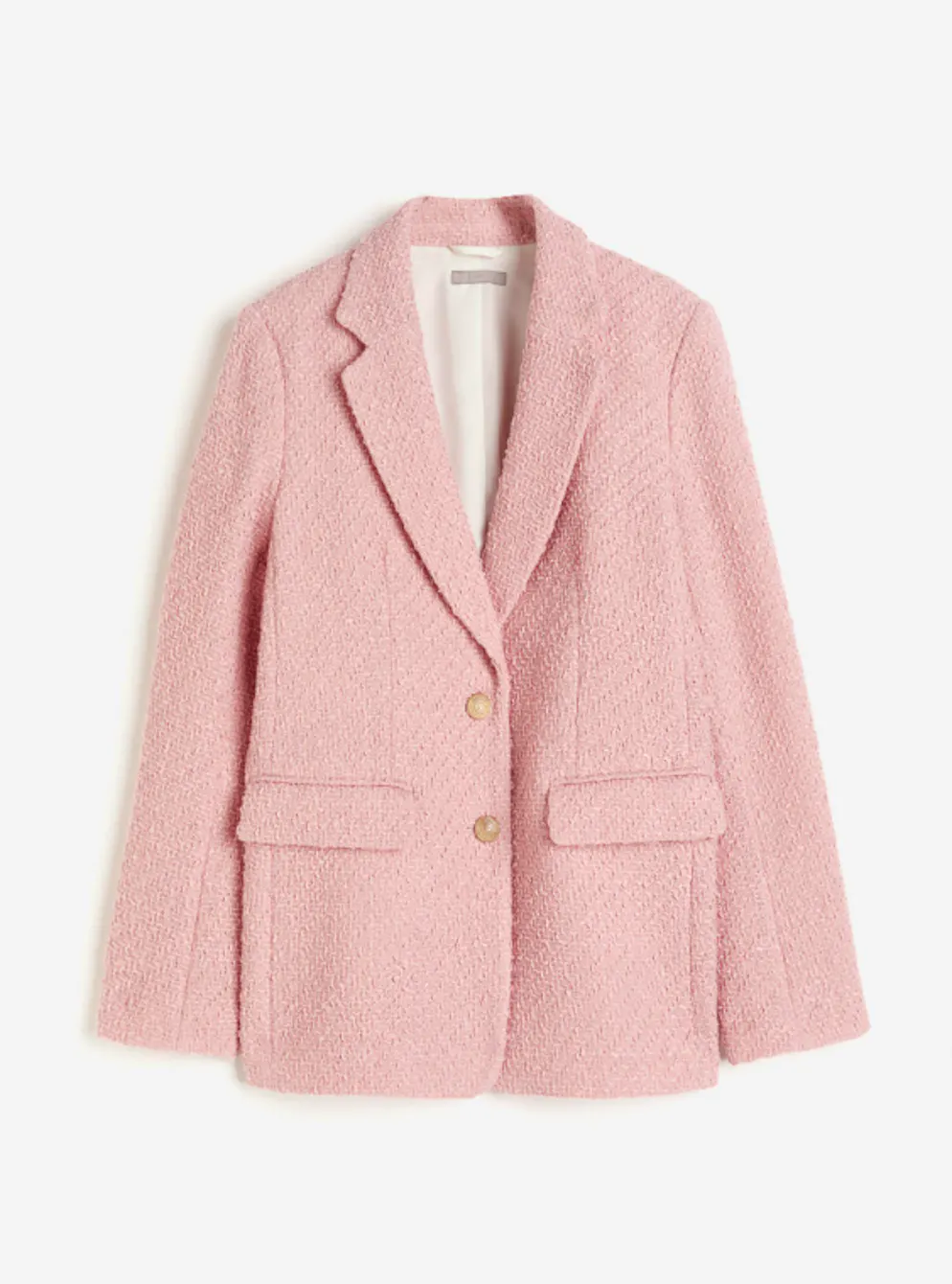2. Trend: Bouclé-Modelle. Rosafarbener Blazer aus Bouclé von H&M für etwa 80 Franken. 
