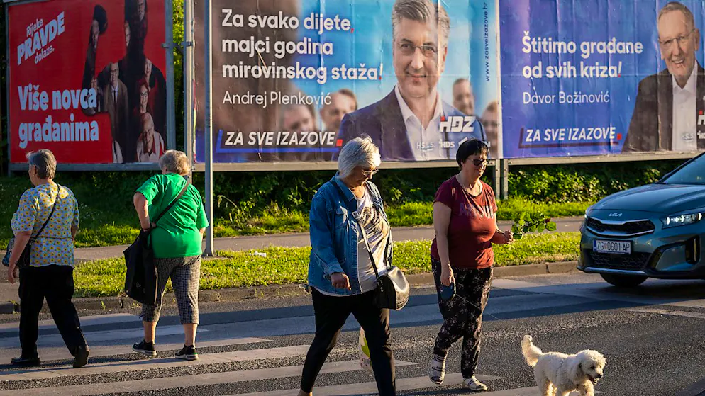 Wahlplakate in Zagreb: Kroatien wählt ein neues Parlament. Foto: Darko Bandic/AP/dpa