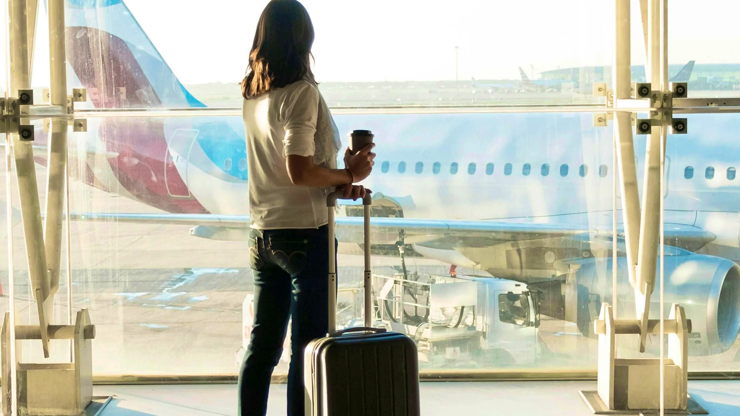 Wrapped in a plastic bag. Woman carries her own heart in her hand luggage on a flight