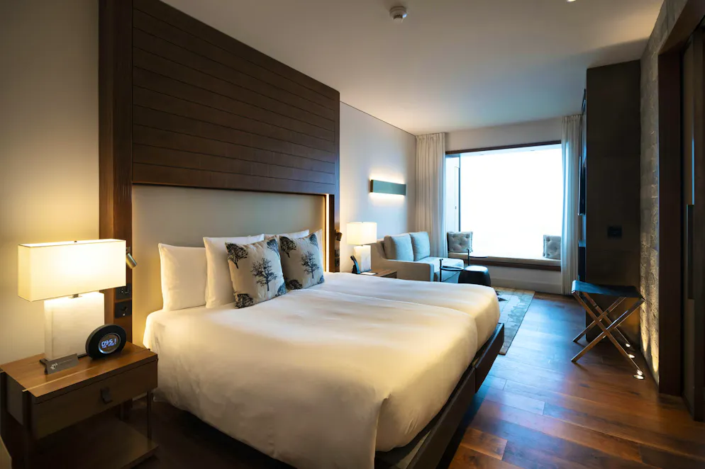 The bed of a hotel room in the Hotel Bürgenstock.