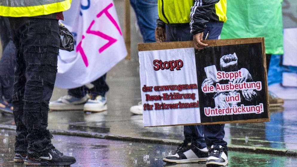 Eritreans demonstrate for their rights in Bern - Gallery. Eritrea rally in the pouring rain.
