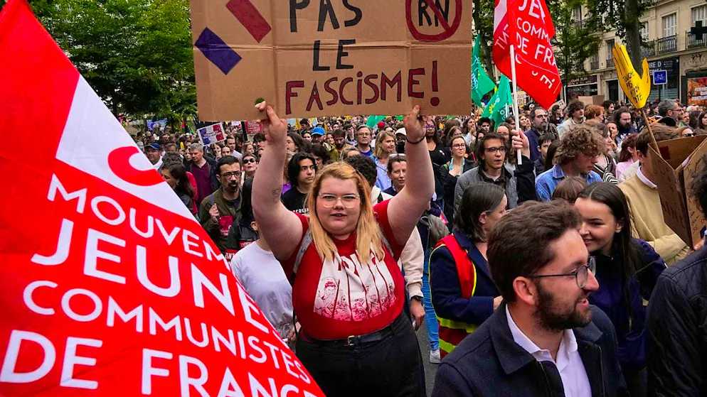 ARCHIVE - A demonstrator holds a banner against the far-right during a rally. Photo: Michel Euler/AP/dpa