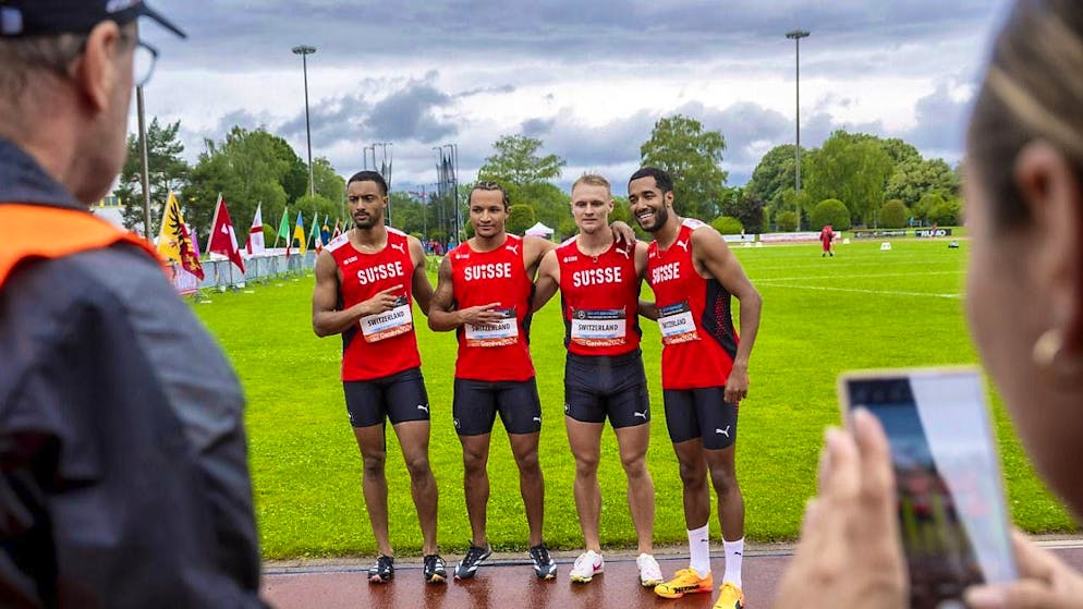 Timothé Mumenthaler, Bradley Lestrade, Felix Svensson and William Reais (from left) pose in the rain