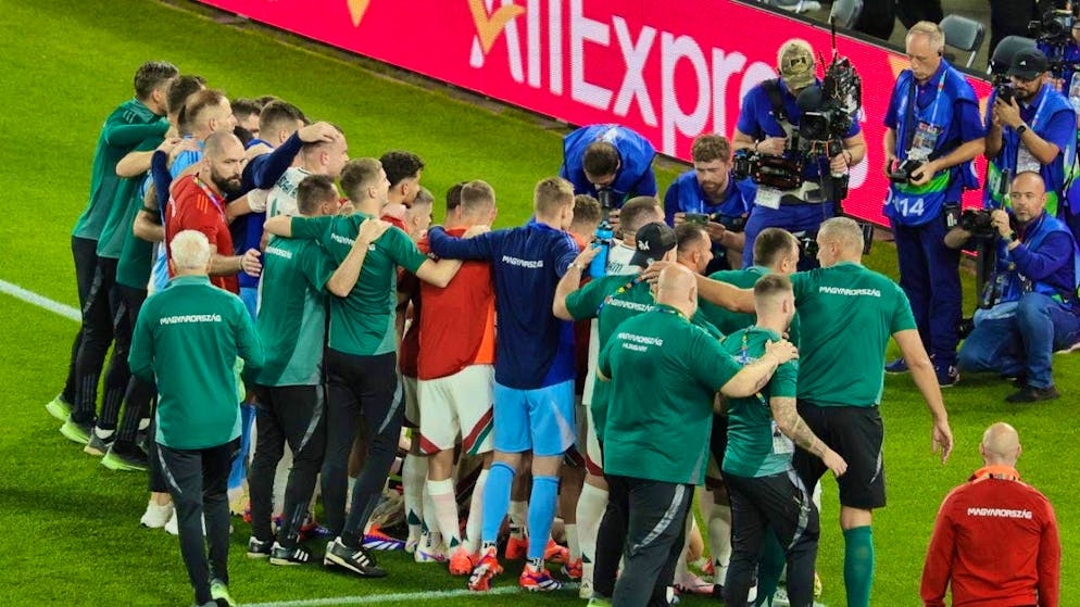 The Hungarian players celebrate after the win