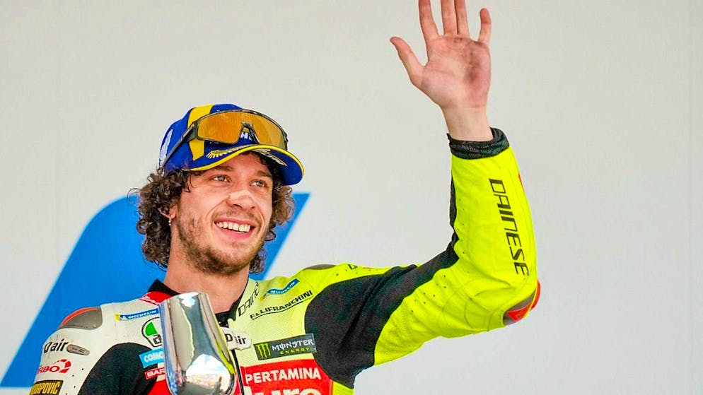 Marco Bezzecchi waves to the audience