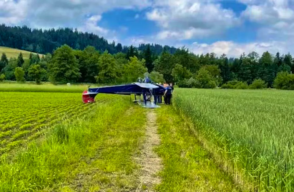 The plane overturned on landing and came to a halt in a field.