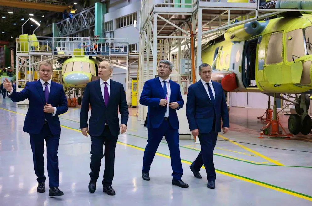 Vladimir Putin (second from left) is shown around an arms factory in Ulan-Ude Aviation on March 14.