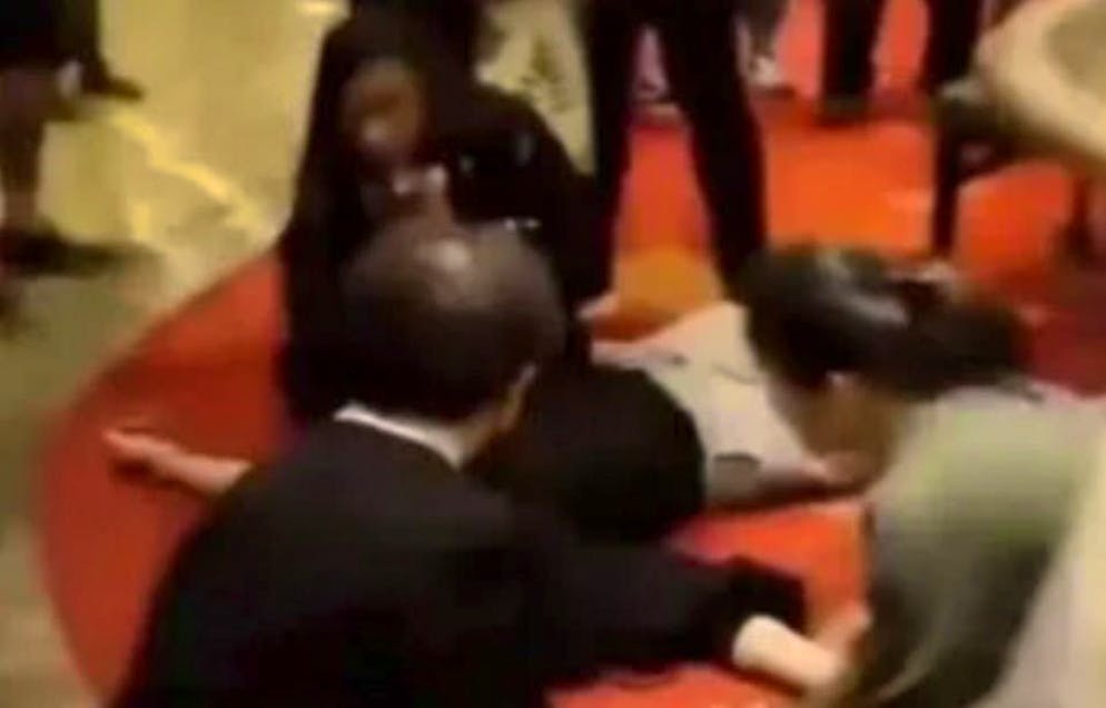 Casino staff give first aid to the man with a heart attack.