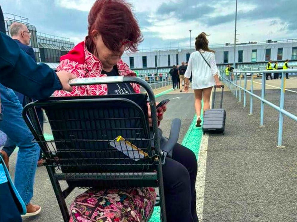 Liz Weir was left on the tarmac at Belfast International Airport on Friday, June 21, 2024, along with another wheelchair user and her husband.