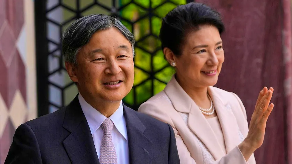 Japan's Emperor Naruhito and Empress Masako wave to the crowd as they arrive at Bethnal Green during a visit to the Young VA. Photo: Kirsty Wigglesworth/AP Pool/AP/dpa