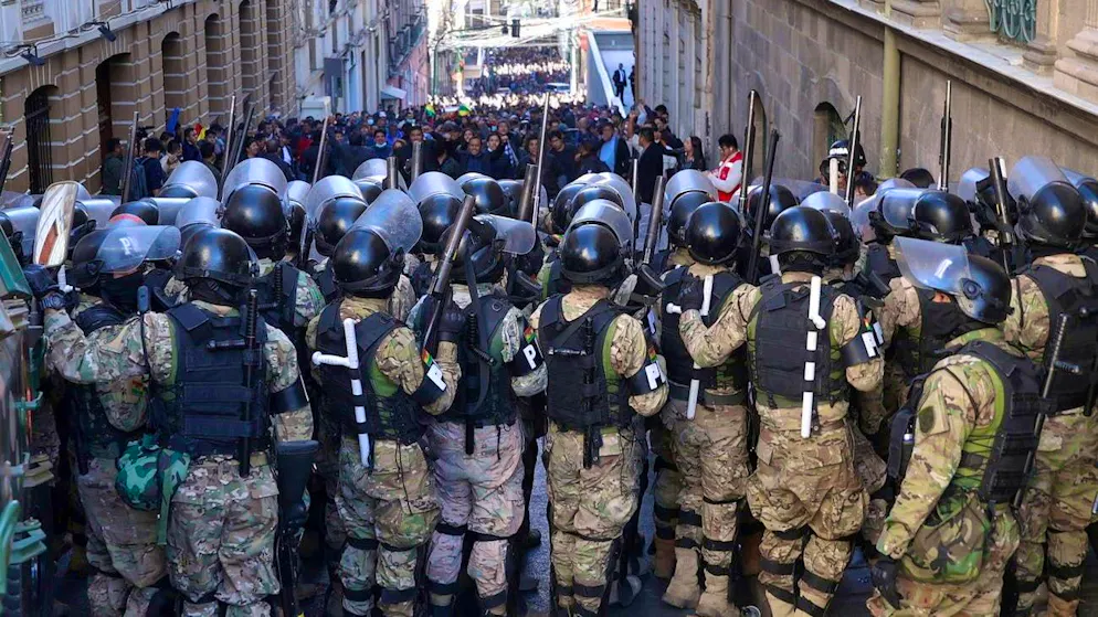 Military police and supporters of Bolivian President Luis Arce in front of the government palace in La Paz. (June 26, 2024)
