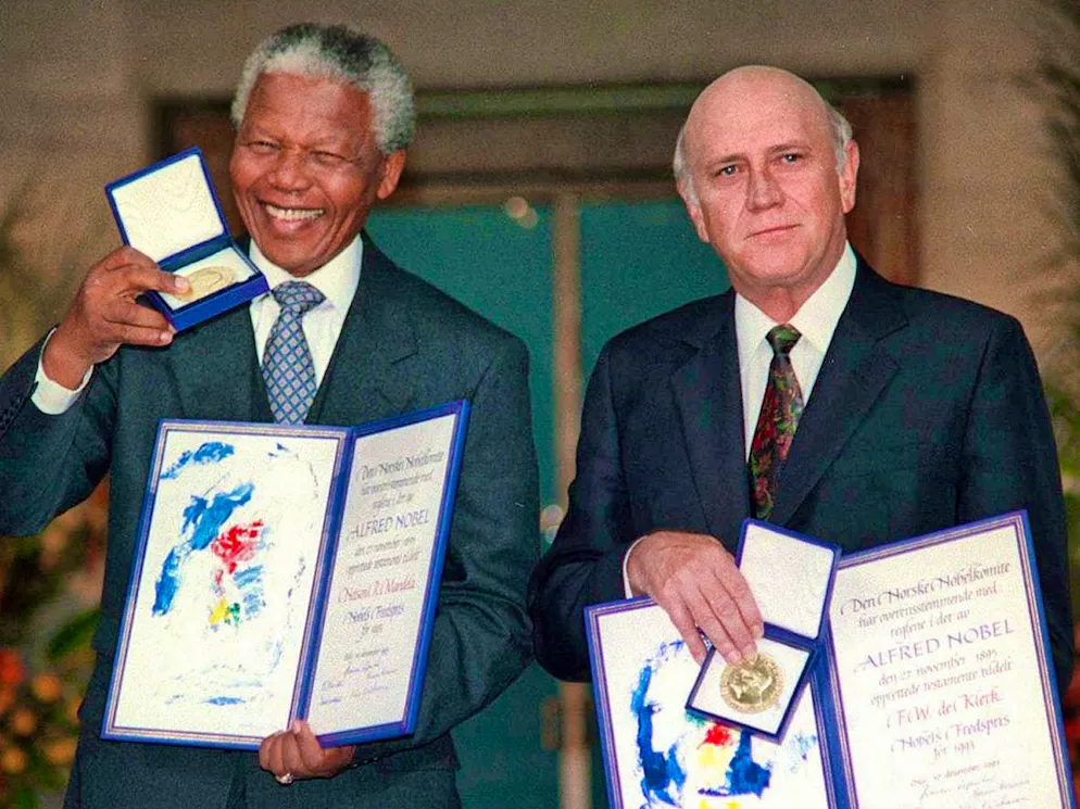 F.W. de Klerk, (right) and his later successor Nelson Mandela.