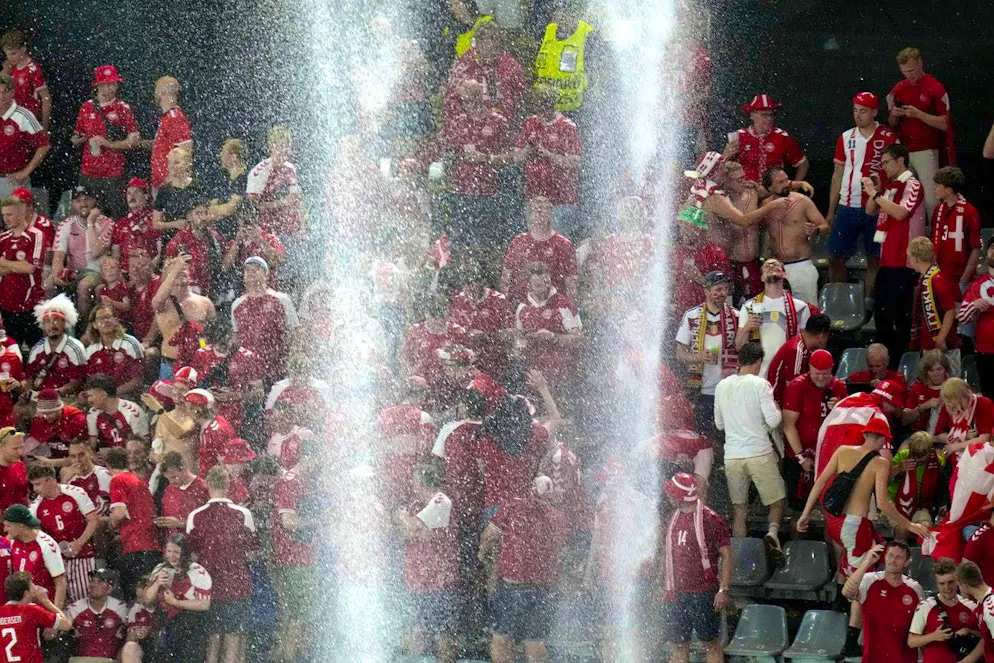 Doomsday atmosphere at the round of 16 final between Germany and Denmark. These fans certainly didn't come to the stadium to see a waterfall.