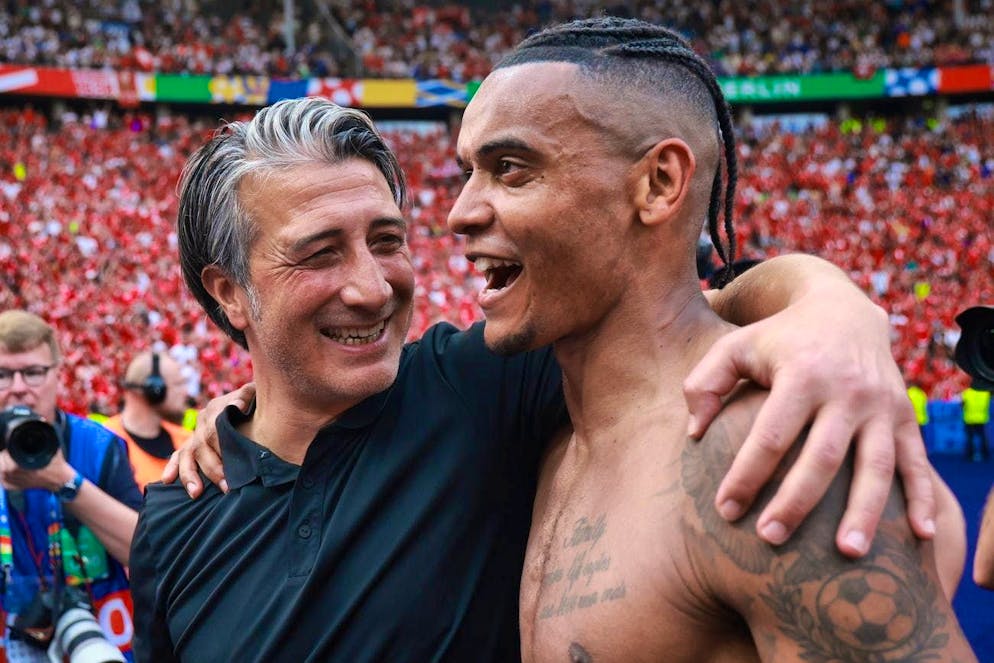 National team coach Murat Yakin and defender Manuel Akanji are celebrated by the fans.
