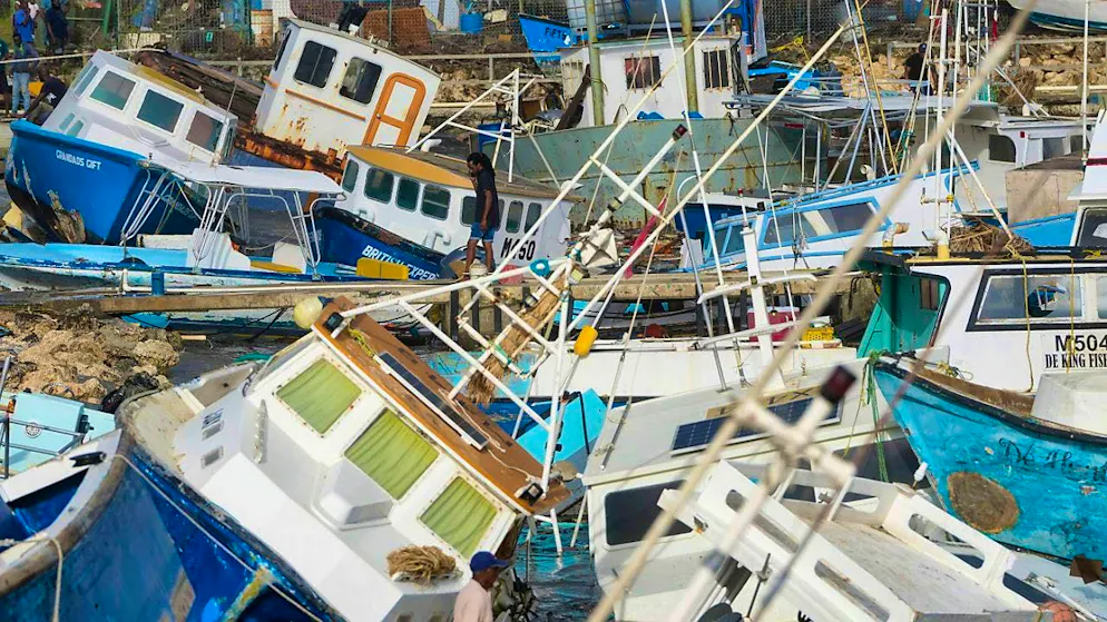 dpatopbilder - A fisherman looks at fishing boats damaged by Hurricane Beryl at Bridgetown Fisheries. Photo: Ricardo Mazalan/AP
