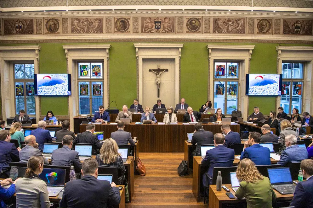 The Zug cantonal government and Zug cantonal council at a cantonal council meeting.