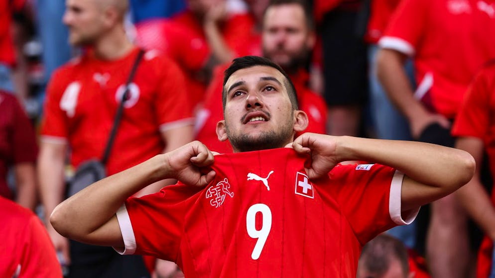 epa11463564 A supporter of Switzerland looks disappointed the UEFA EURO 2024 quarter-finals soccer match between England and Switzerland, in Dusseldorf, Germany, 06 July 2024. EPA/ANNA SZILAGYI
