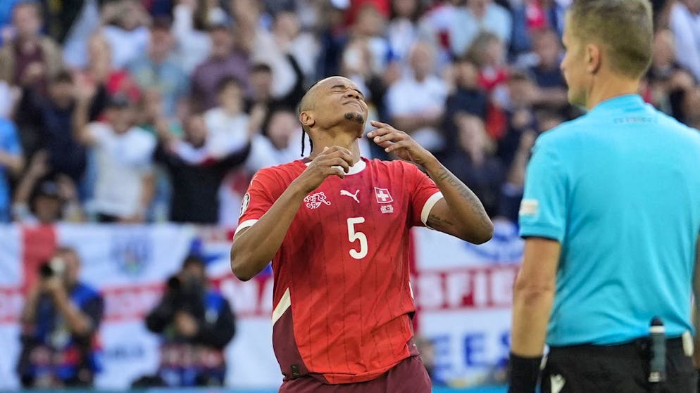 Switzerland's Manuel Akanji reacts after failing to score during the penalty shootout of a quarterfinal match between England and Switzerland at the Euro 2024 soccer tournament in Duesseldorf, Germany, Saturday, July 6, 2024. (AP Photo/Martin Meissner)