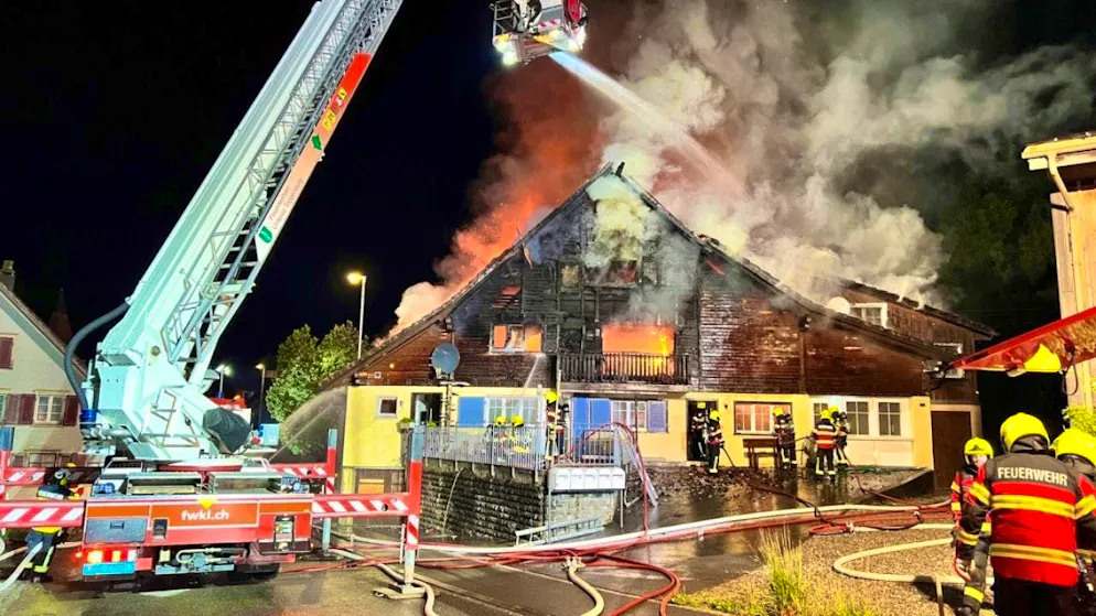 The apartment building was engulfed by flames.