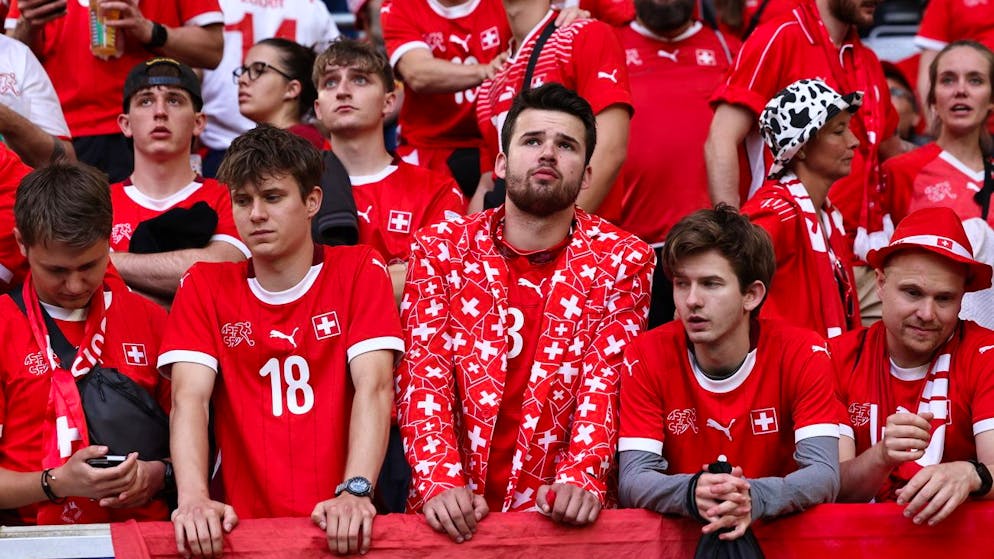 epa11463558 Supporters of Switzerland look disappointed after losing the UEFA EURO 2024 quarter-finals soccer match between England and Switzerland, in Dusseldorf, Germany, 06 July 2024. EPA/ANNA SZILAGYI