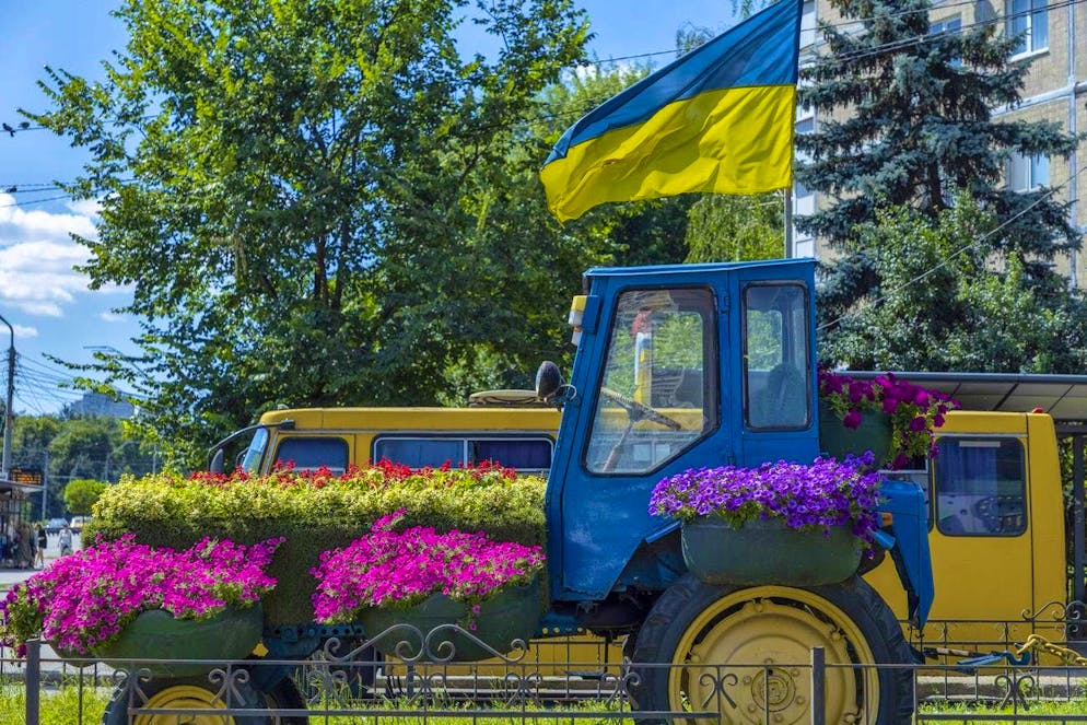 Blooming splendor in dark times: Kiev defies the hardships of war. ... like this colorful tractor.