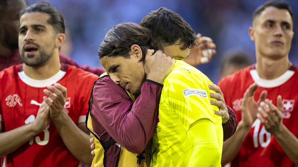 Switzerland's Ricardo Rodriguez, Switzerland's Fabian Rieder, Switzerland's goalkeeper Yann Sommer, and Switzerland's Vincent Sierro, from left to right, react after losing the shootout during the overtime, during a quarter final match between England and Switzerland at the Euro 2024 soccer tournament in Duesseldorf, Germany, Saturday, July 6, 2024. (KEYSTONE/Peter Klaunzer)