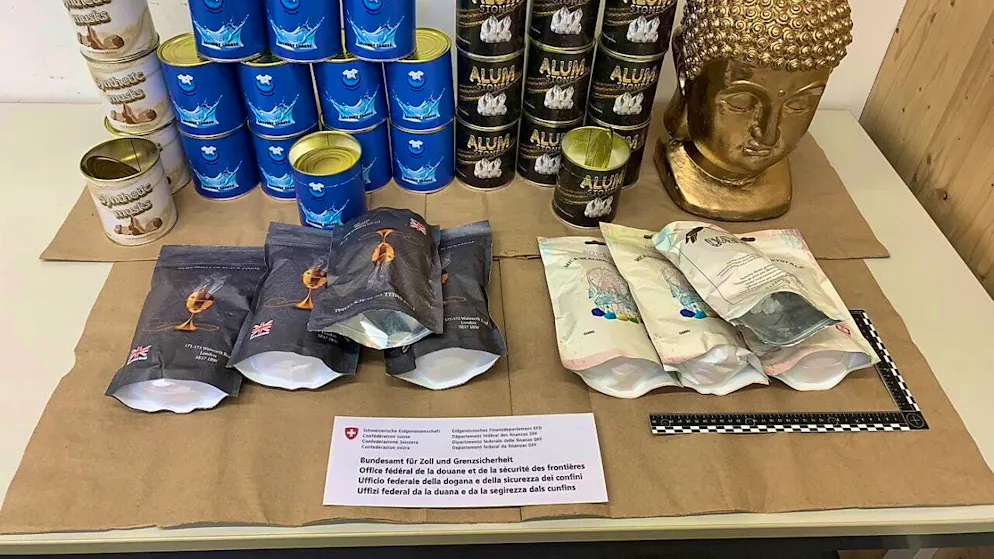 Drugs were hidden in these cans, bags and in the Buddha figure.